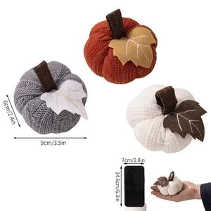 Size guide for knitted Thanksgiving pumpkin ornaments in orange, white and grey colors