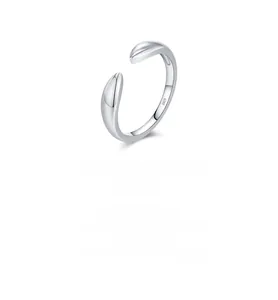 Macro shot of polished S925 sterling silver open ring featuring a smooth minimalist design