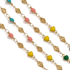 Detail of 18K gold plated stainless steel chain with colorful enamel hearts and rhombuses
