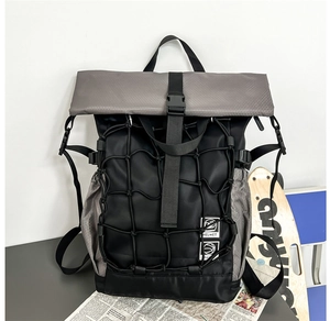 Detail of multi-functional basketball backpack with roll-top closure and mesh pocket