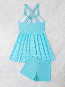 Detail of light blue two-piece swimsuit featuring hollow floral lace and mesh texture