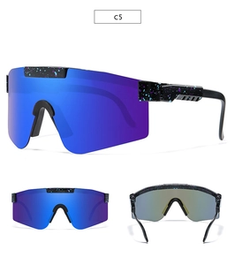Detail view of sport sunglasses with blue-purple mirrored lenses and black paint splatter frame