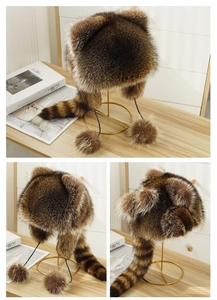 Faux fur animal hat with brown stripes, long tail, and pompom charms for winter warmth