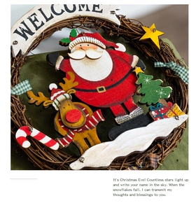 Detailed close-up of handmade Christmas wreath with Santa Claus and festive wood carvings