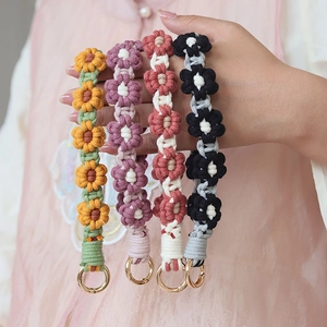 Handmade crochet flower phone charms in four colors with golden metal rings