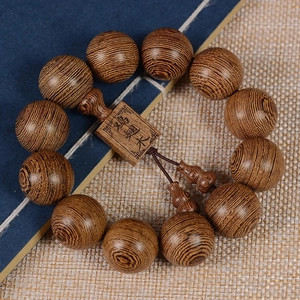 Bracelet mala en bois de Wengé poli avec grain naturel et breloque gravée