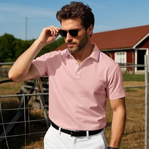 Detailed view of pink men polo shirt with tri-color striped collar at outdoor ranch