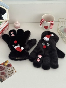 Close-up of black snowman plush mittens with a festive mini hat and plaid button detail