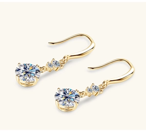 Detail view of gold S925 sterling silver drop earrings with moissanite stones
