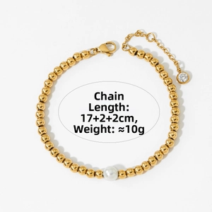 Detail of gold beaded pearl bracelet with lobster clasp and adjustable extension chain