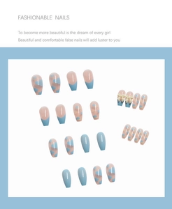 Detail of blue and pink press-on nails with 3D bow accents and heart patterns