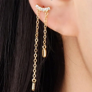 Close-up of gold plated S925 sterling silver tassel earring with sparkling crystal studs