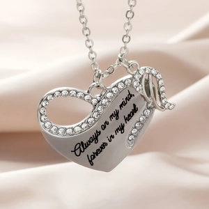 Silver angel wing heart necklace with Always on my mind engraving on satin
