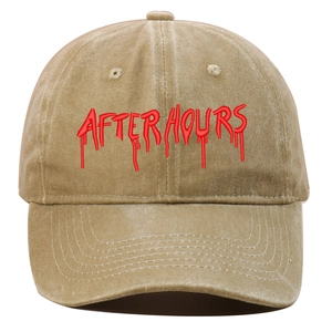 Close-up of red AFTER HOURS embroidery on a khaki washed cotton baseball cap with curved brim