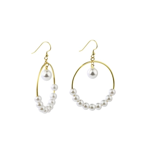 Golden stainless steel hoop earrings with elegant white pearls on a clean white background