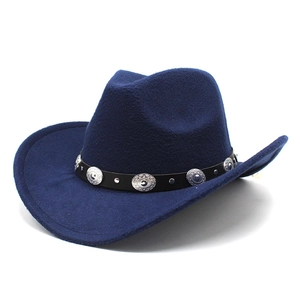 Detail of navy blue felt cowboy hat featuring black decorative band with silver studs