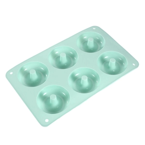 Light green 6-cavity silicone donut mold for baking on a clean white background