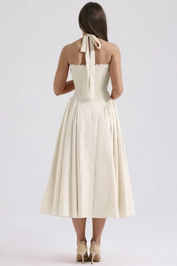 Detailed back view of cream halter neck midi dress with elegant lace tie details
