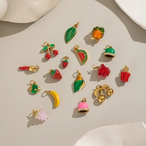 Golden stainless steel enamel fruit pendants including strawberry, grape, and banana charms