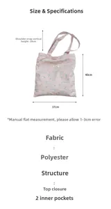 Detail of pink canvas tote bag with blue cat prints and dimensions 40x37cm