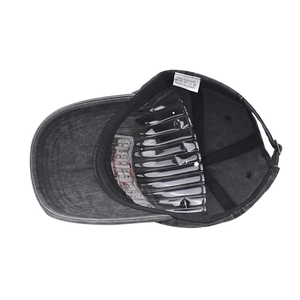 Close-up of internal 100% cotton washing label and lining of the washed black baseball cap
