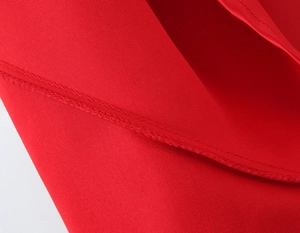 Close-up of red fabric texture and precise stitching on the elegant mermaid dress
