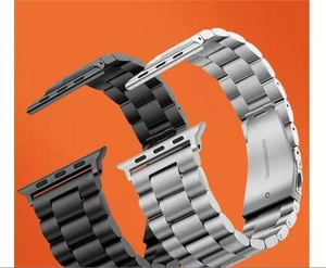Detail of matte black and brushed silver stainless steel three-bead watch bands