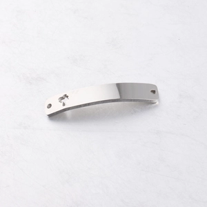 Macro view of curved stainless steel connector with hollow elephant and crown detail