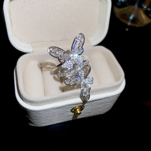 Macro shot of silver butterfly ring with sparkling pave cubic zirconia crystals