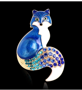 Detailed close-up of a blue fox brooch with enamel finish and gradient rhinestones