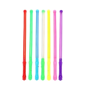 Colorful LED glow sticks for concerts and parties with textured handles on white background