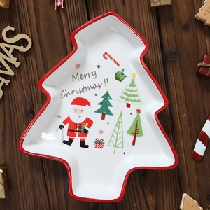 Christmas tree shaped ceramic snack plate with painted Santa Claus and red border design