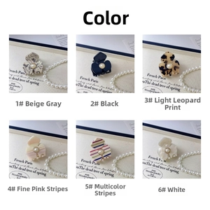 Detailed grid view of six floral acetate hair claws with pearls in multiple colors