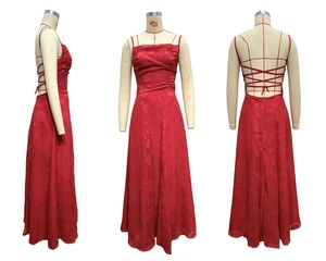 Detail of burgundy backless maxi dress featuring intricate criss-cross lace-up straps