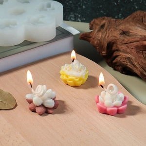 Detailed macro view of burning lotus flower candles made from 3D silicone molds