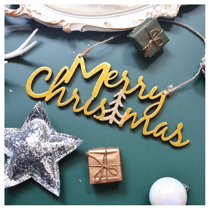 Golden Merry Christmas wooden sign with glitter tree and jute rope on green background