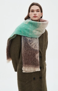 Detail of color-block jacquard scarf with fringe in brown, green and beige tones