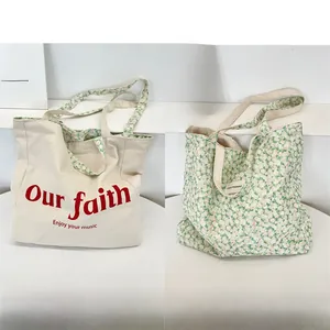 Detailed views of double-sided floral canvas tote bag with red text and green flower print