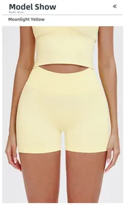 Front detail of high-waisted seamless fitness shorts and crop top in moonlight yellow
