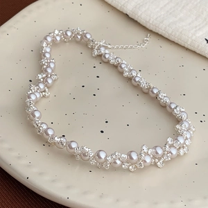 Elegant white pearl and crystal beaded necklace with spiral weave and adjustable chain