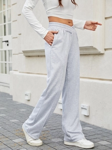 Pantaloni svasati sportivi grigio chiaro da donna con elegante vita bassa incrociata