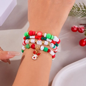 Close-up of a multi-layer Christmas beaded bracelet set with Santa and Reindeer charms