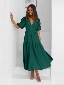 Detailed view of the deep green V-neck midi dress with tiered skirt and puff sleeves