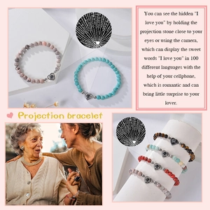 Pink zebra stone heart projection bracelet showing 100 languages I Love You with elastic band