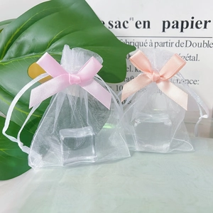 Mini organza gift bags with pink ribbon bow and drawstring closure for jewelry