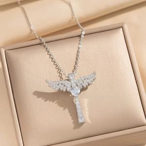 Exquisite silver-toned cross and angel wings necklace with heart-shaped zircon in gift box