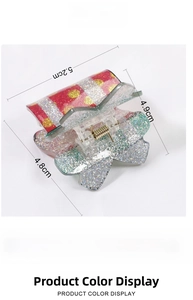 Christmas star hair claw with festive glitter details and technical dimensions 5.2x4.9cm