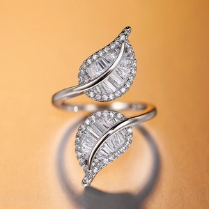 Exquisite silver leaf open ring with sparkling pavé zircons on golden gradient background