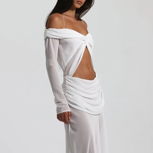 Detail view of the white off-shoulder twist front cutout and sheer pleated skirt fabric