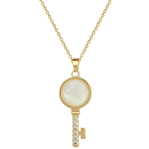 Elegant gold titanium steel necklace with a crystal-studded key pendant and opal center